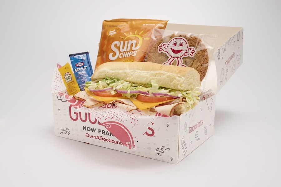 Box with sub, cookie, chips, and condiments